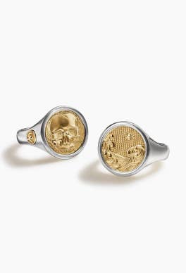 Two David Yurman signet rings in silver and gold.